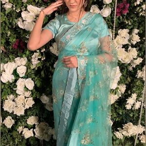 Elegant custom-made Turquoise Floral Net Saree
